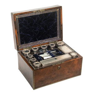 ENGLISH BURR WALNUT VANITY BOX WITH STERLING FITTINGS: Victorian Traveling Vanity Box, with inlaid brass burr walnut exterior, the lid interior with a tooled leather and velvet drop down panel with removable mirror behind, the fitted interior containing (