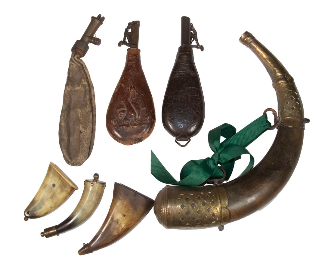 (7) ASSORTED POWDERHORNS & FLASKS: Including: 19th c. Large Ottoman powderhorn, with geometric design pierced and chased brass mounts, two attached suspension rings, 14" wide, 2 1/2" diam.; (2) Other polished horn flasks, 4" and 5 1/4"