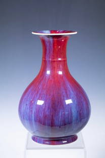 CHINESE FLAMBE-GLAZED YUHUCHUNPING VASE, 19TH C. OR EARLIER: The baluster-form vase with a gently swelling body rising to a waisted neck and flared rim, covered overall in a rich transmutation (flamb ) glaze of deep red and purplish streaks pooling to lavender