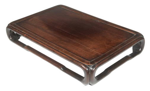 CHINESE HUANGHUALI WOOD DISPLAY STAND, QING DYNASTY: Qing Dynasty Rectangular Plateau, with inset top panel, having a mortise and tenon constructed frame and rounded corners, set on curved legs with humpback stretchers. Missing one stretcher; top shrink