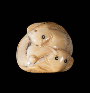JAPANESE 19TH C. ENTWINED CATFISH IVORY NETSUKE, SIGNED: A finely carved ivory netsuke depicting two intertwined catfish, their long bodies coiled in a compact composition. Delicate line incisions define the fins and whiskers; eyes inlaid in dark horn. Two