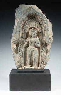 GANDHARA CARVED STONE PLAQUE ON STAND: Architectural Plaque in black schist, Pakistan or Afghanistan, 200 BCE - 200 CE, having a peaked portico presenting the female deity Hariti, originally a demoness who was converted by Lord Buddha to t