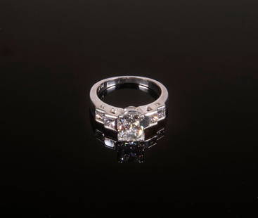 DIAMOND AND PLATINUM LADIES RING: Contemporary design ring set with (1) radiant brilliant cut diamond with (2) princess cut diamonds on each side; center diamond with GIA Certificate, August 2000, report no.11213786; center diamond me