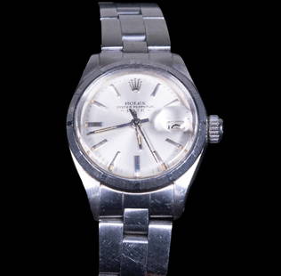 ROLEX LADIES STAINLESS STEEL DATEJUST WRISTWATCH: Circa 1970s Rolex Sigma Dial Oyster Perpetual Date, Ref. #6517. Stainless steel 26mm Datejust with engine-turned bezel and domed crystal. Silver sunray sigma (indicating indices and hands are 18k whit