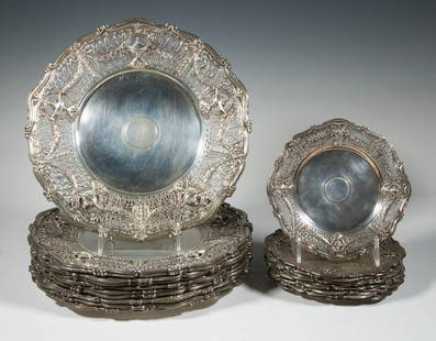 (23) STERLING SILVER PIERCED PLATES BY SHREVE & CO., SAN FRANCISCO, PATENTED 1911: A rare and elegant set of (23) sterling silver plates by Shreve & Co., San Francisco, dated 1911. Comprising (11) large dessert or luncheon plates (patent no. 3728) and (12) smaller side or pastry pla