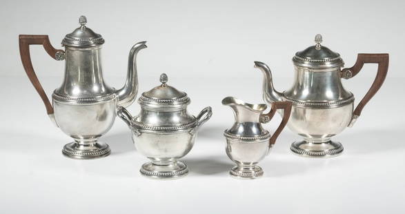 (4) FRENCH STERLING .950 SILVER TEA AND COFFEE SERVICE SET: A fine Louis XVI-style sterling silver tea and coffee set comprising a teapot, coffee pot, sugar bowl with lid, and creamer. Each piece of flared baluster form with beaded foot and rim, topped with pi