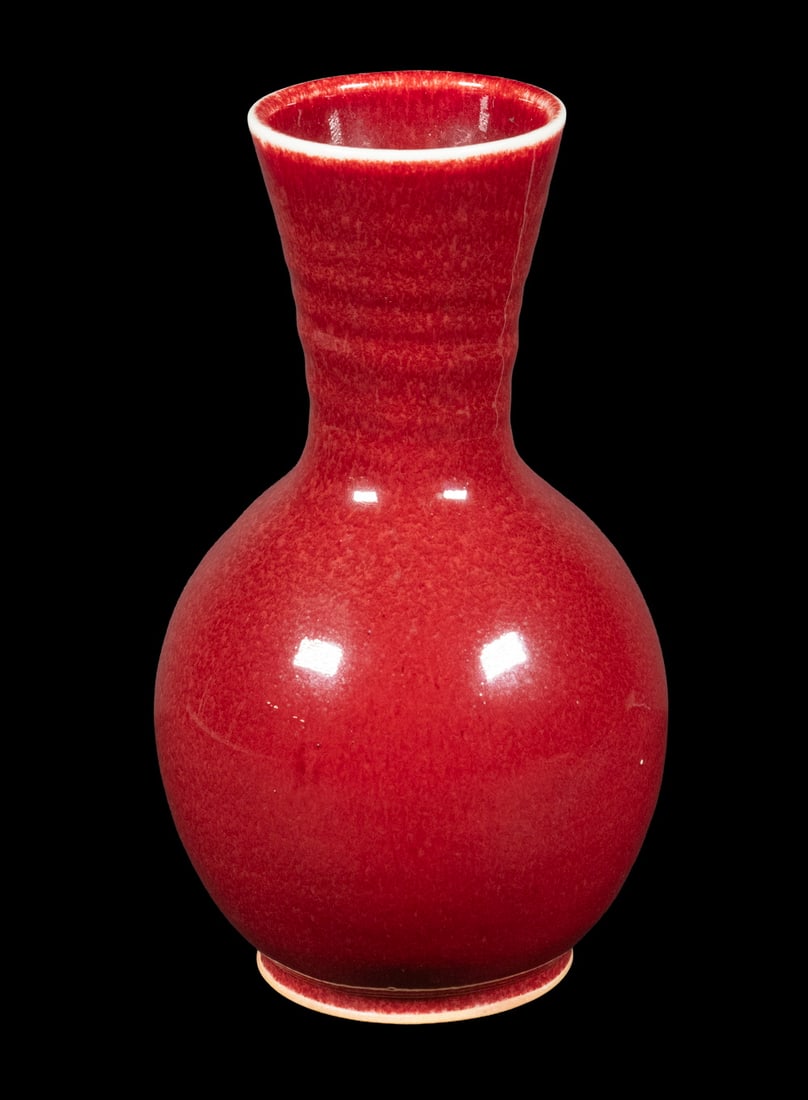 BROTHER THOMAS BEZANSON (1929–2007) COPPER RED GLAZED VASE: A refined studio pottery vase by Brother Thomas Bezanson, with a brilliant copper red glaze flowing evenly over a balanced form. Signed and inscribed on the base, with an incised “Brother Thomas