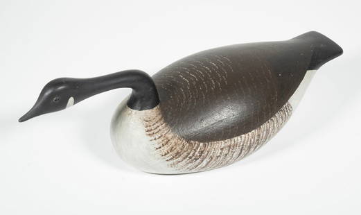 QUARTER-SIZED CANADA HISSING GOOSE DECOY BY JOSEPH LINCOLN: Joe Lincoln Display Decoy of a Hissing Goose, stamped on underside "Joe Lincoln, Accord, Massachusetts". 13 1/2 in. (34.3 cm.)