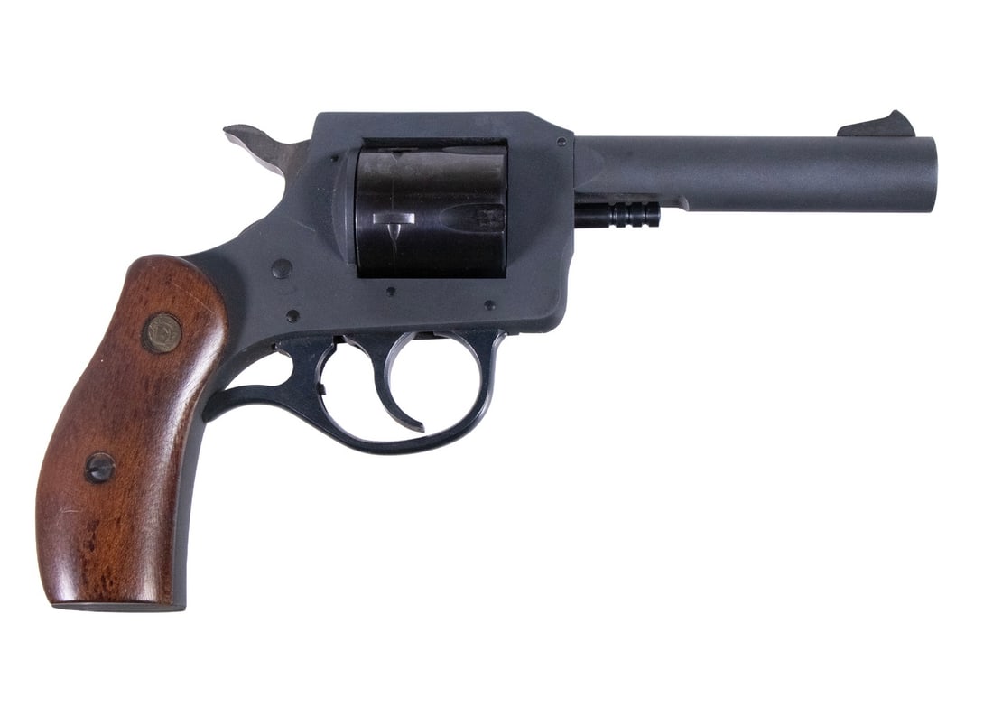 N.E.F. R-73 REVOLVER, .32 H&R MAG: An offering of a magnum revolver made by New England Firearms of Gardner, Massachusetts. The revolver features a gray parkerized finish with the hammer being in the white and smooth wooden grip panels