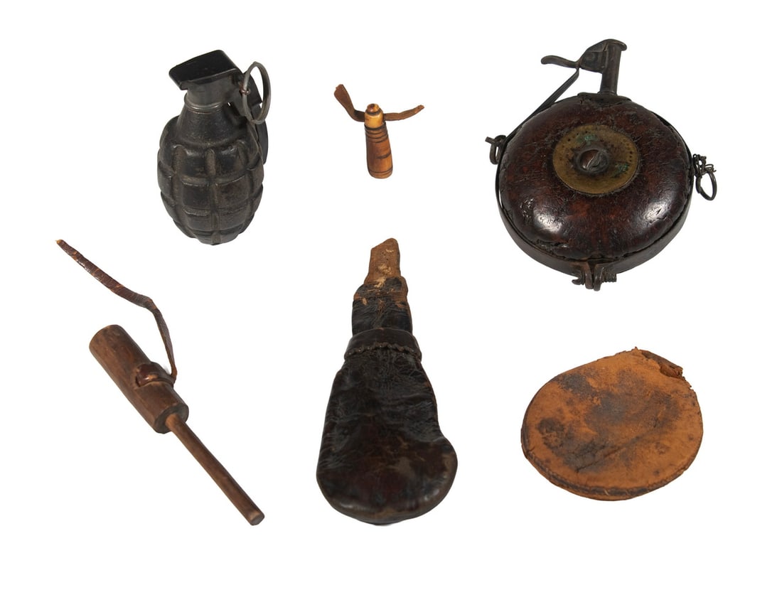 EARLY POWDER FLASK, SHOT FLASK & WWII TRAINING GRENADE: 18th c. Discus form brass bound leather over wood power measure, 4" x 5 3/4"; Leather Teardrop Shot Bag, 8" long, smaller leather pouch, stopper on thong, bone tip, bits. PLUS MKii pineapple grenade,