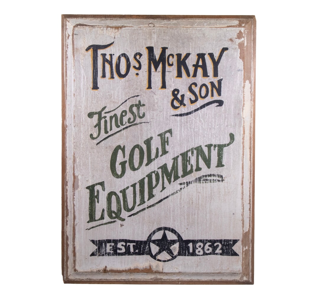 THOS. McKAY & SON "FINEST GOLF EQUIPMENT" ADVERTISING SIGN ON WOOD PANEL: A rectangular wooden advertising sign painted in black and green lettering reading “Thos. McKay & Son – Finest Golf Equipment – Est. 1862”, with central star motif. The surface