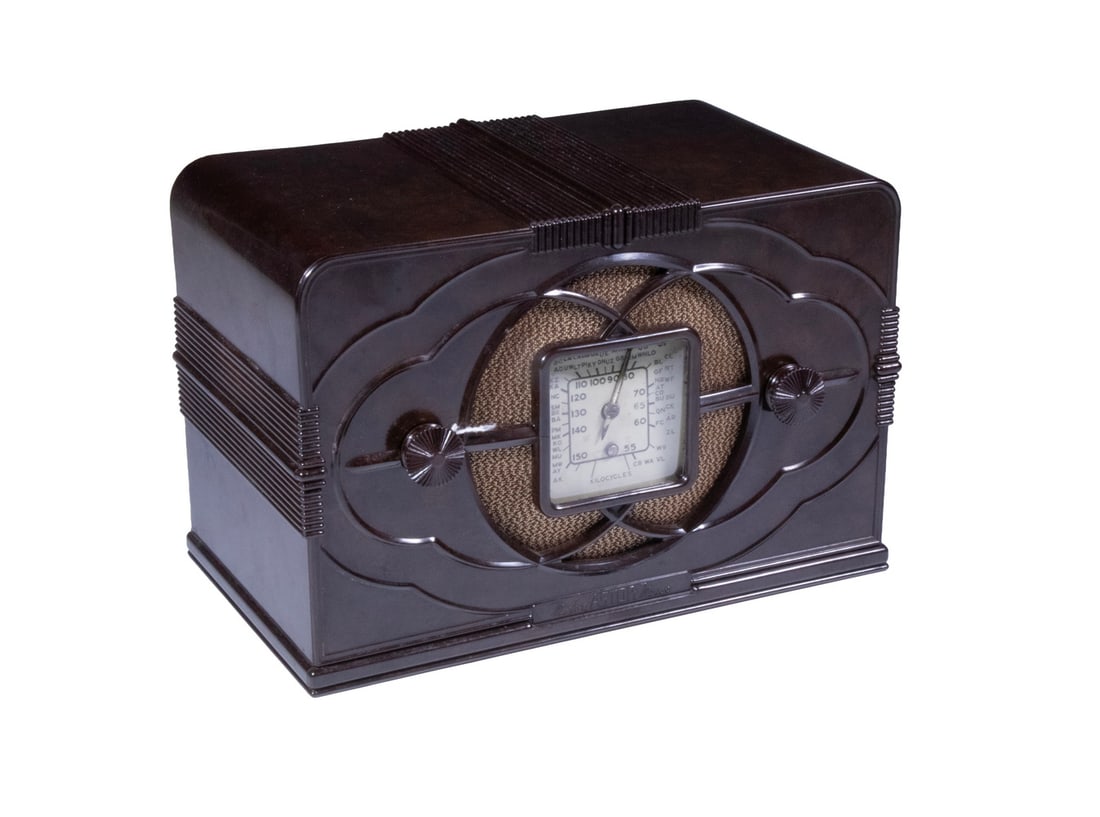 ASTOR BAKELITE MICKEY MOUSE RADIO: Desirable Astor Model BP, Made in Australia, 1937-1940, brown bakelite case, broadcast-band tube receiver, retaining original Mickey paper label on chassis, stamped EG 2202.This is the battery-operate