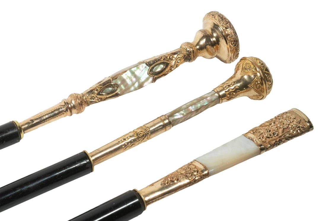 (3) WALKING STICKS WITH MOTHER OF PEARL & GOLD FILLED TOPS: (3) Late 19th c. Ebony Dress Canes, all with mother-of-pearl and gold filled tops, incl: (2) Ball top sticks, one with engraved top monogram, 37 1/2" and 41" long, one with small corner chip; and (1)