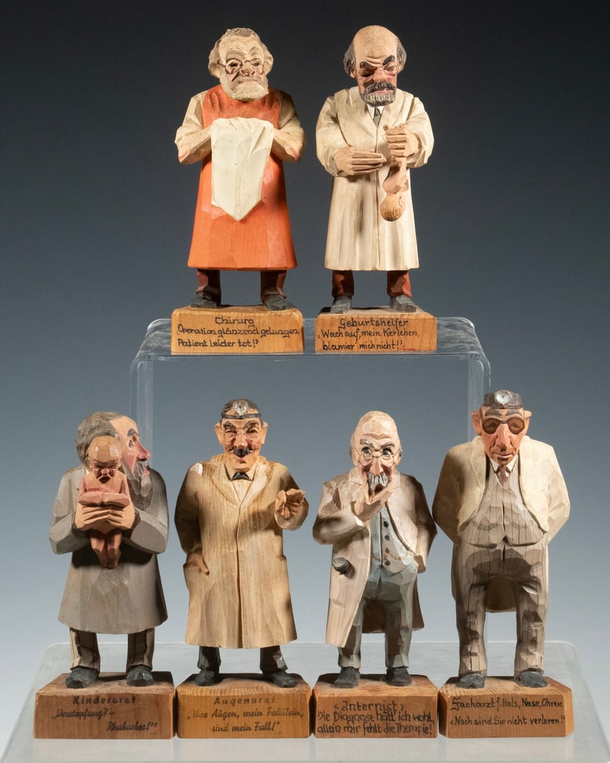 (6) BLACK FOREST CARVED DOCTOR FIGURES: Set of (6) Vintage Humorous Swiss Hand Carved Figures, each standing on a platform with inked German caption (some with English translation affixed to the base). LGST: 5 1/2 in. (14 cm.) SMST: 5 in. (