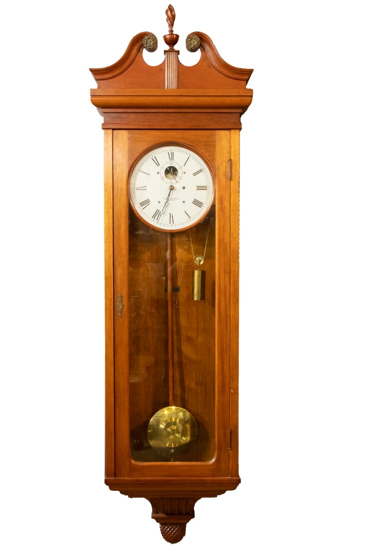 E. HOWARD WALL CLOCK #89: E. Howard Company Railroad Regulator, in a cherry chippendale case, having broken pediment and flame finial, brass 8-day weight-driven movement with deadbeat escapement. Retaining original brass pendu