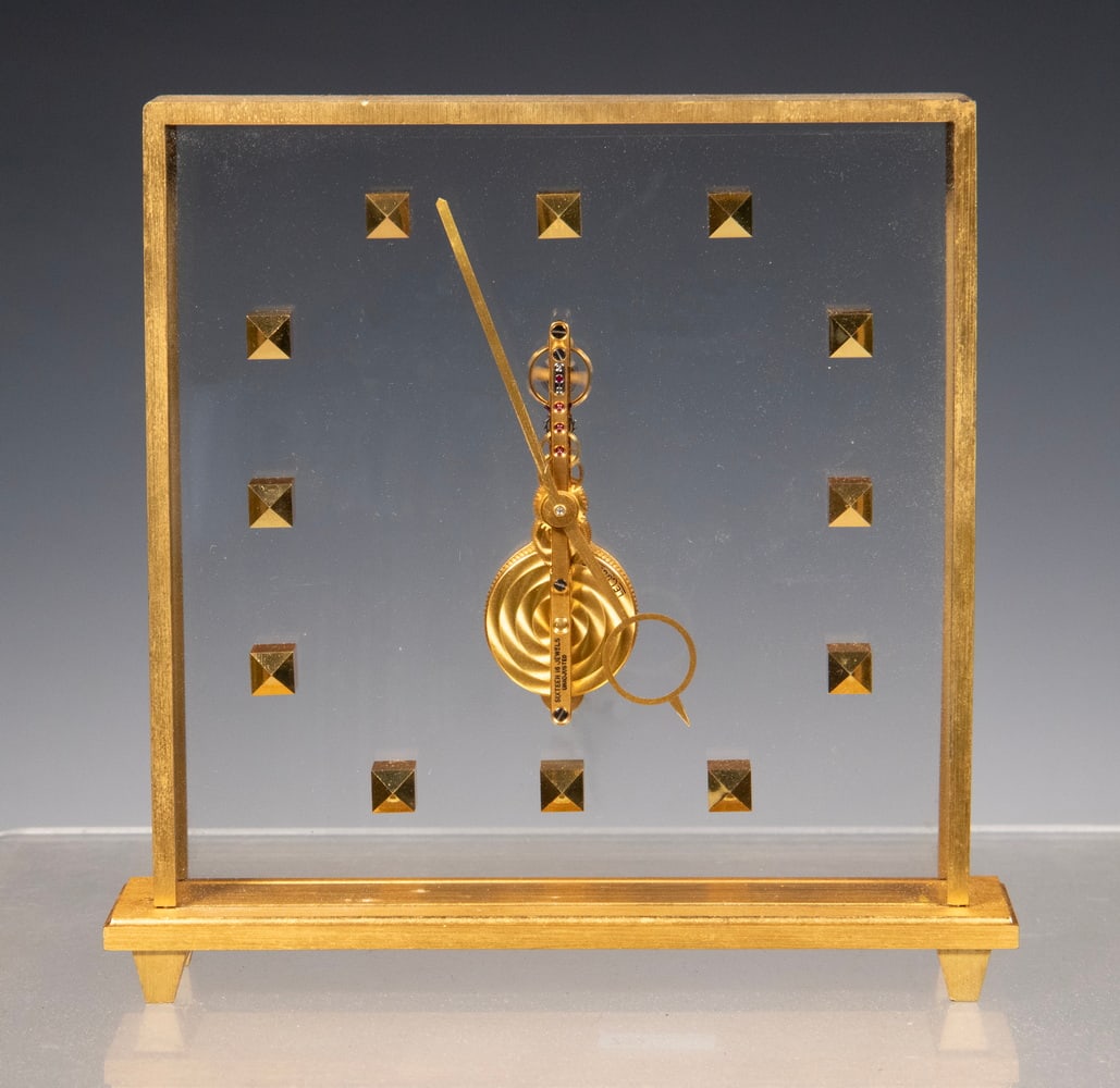 JAEGER-LECOULTRE MIDCENTURY SKELETON DESK CLOCK: Fine Swiss-Made Mystery Timepiece, #354, 16-jewels unadjusted, with brass case, transparent front and back dial panels, gilt straight line lever, set on shaped feet. Running. 6 1/2 x 6 1/2 x 1 1/2 in.
