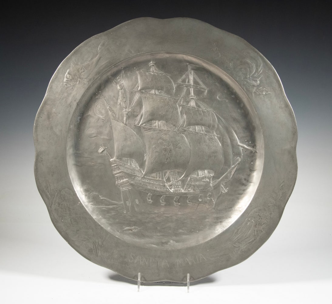 KAYSERZINN CHARGER OF SHIP "SANTA MARIA": Marked by the company, with model mark 4-126, having a raised depiction of Columbus' Flagship, in three-quarter stern view, sailing away from the viewer. Diam. 20 1/2 in. (52.1 cm.)