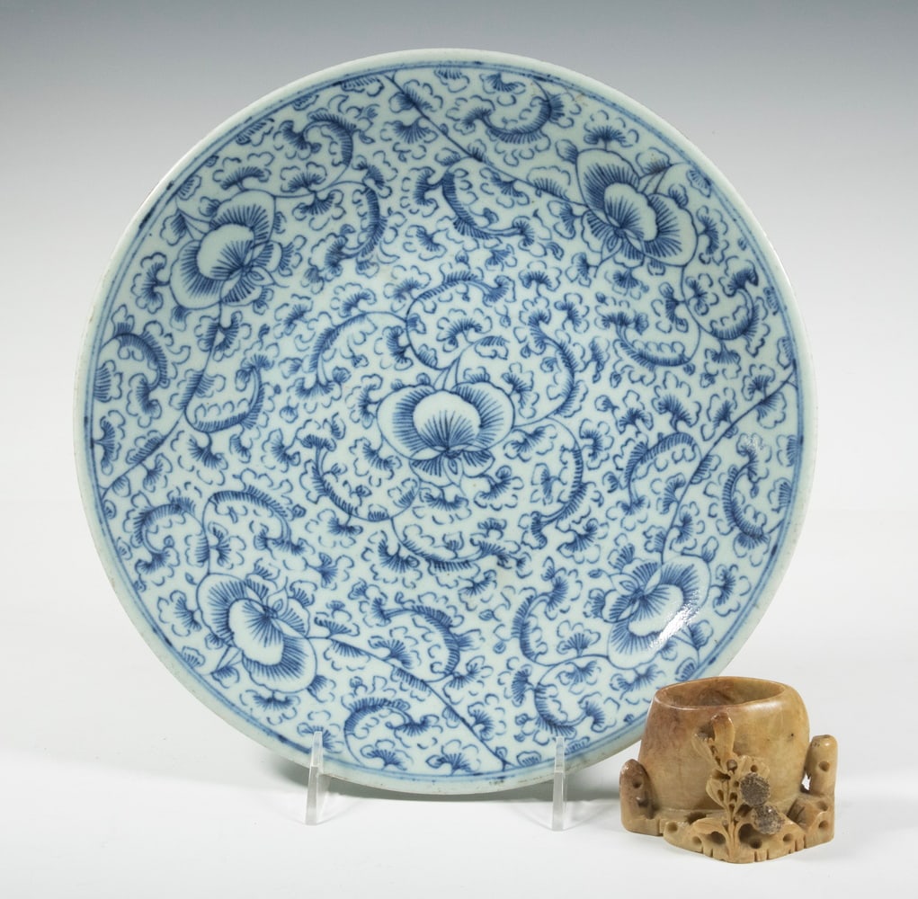 (2) CHINESE PORCELAIN CHARGER & WATER COUPE: Blue and White Export Charger, with floral decoration and a Chinese soapstone water coupe. 11 1/2 in. (29.2 cm.)