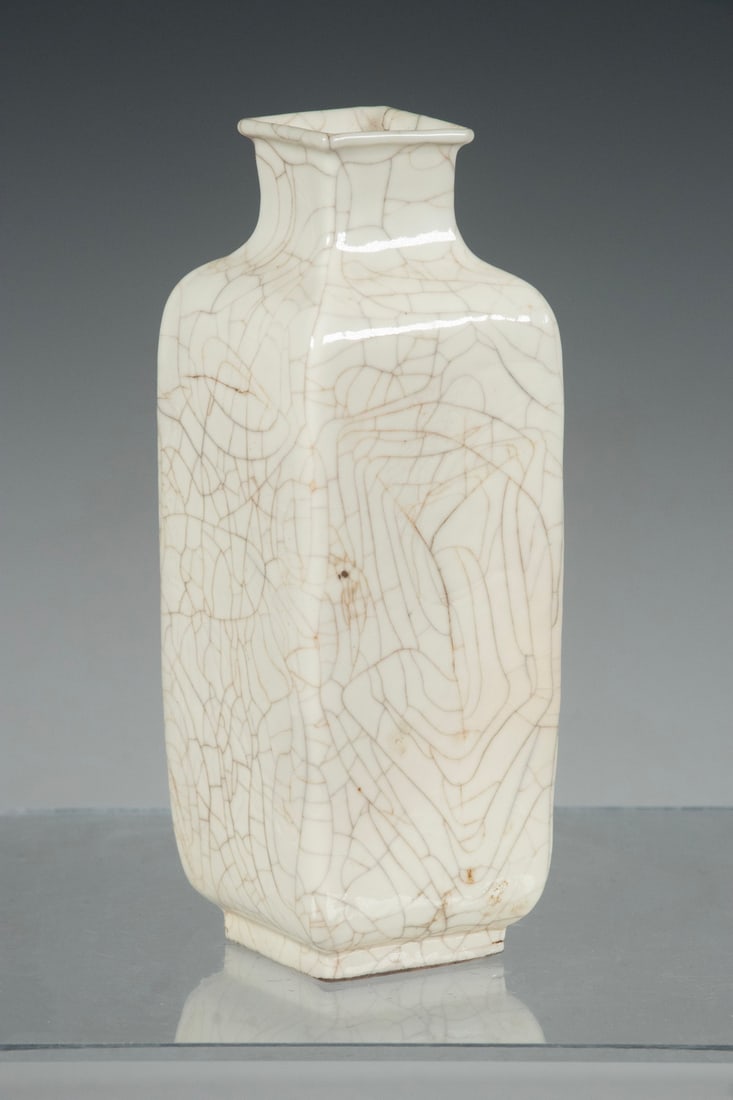 CHINESE WHITE CRACKLE GLAZE VASE: Of flattened rectangular form with a dense network of crackles throughout the surface. With an apocryphal four-character Kangxi mark to underside. With star cracking to vase walls. 5 1/2 x 2 x 2 in. (