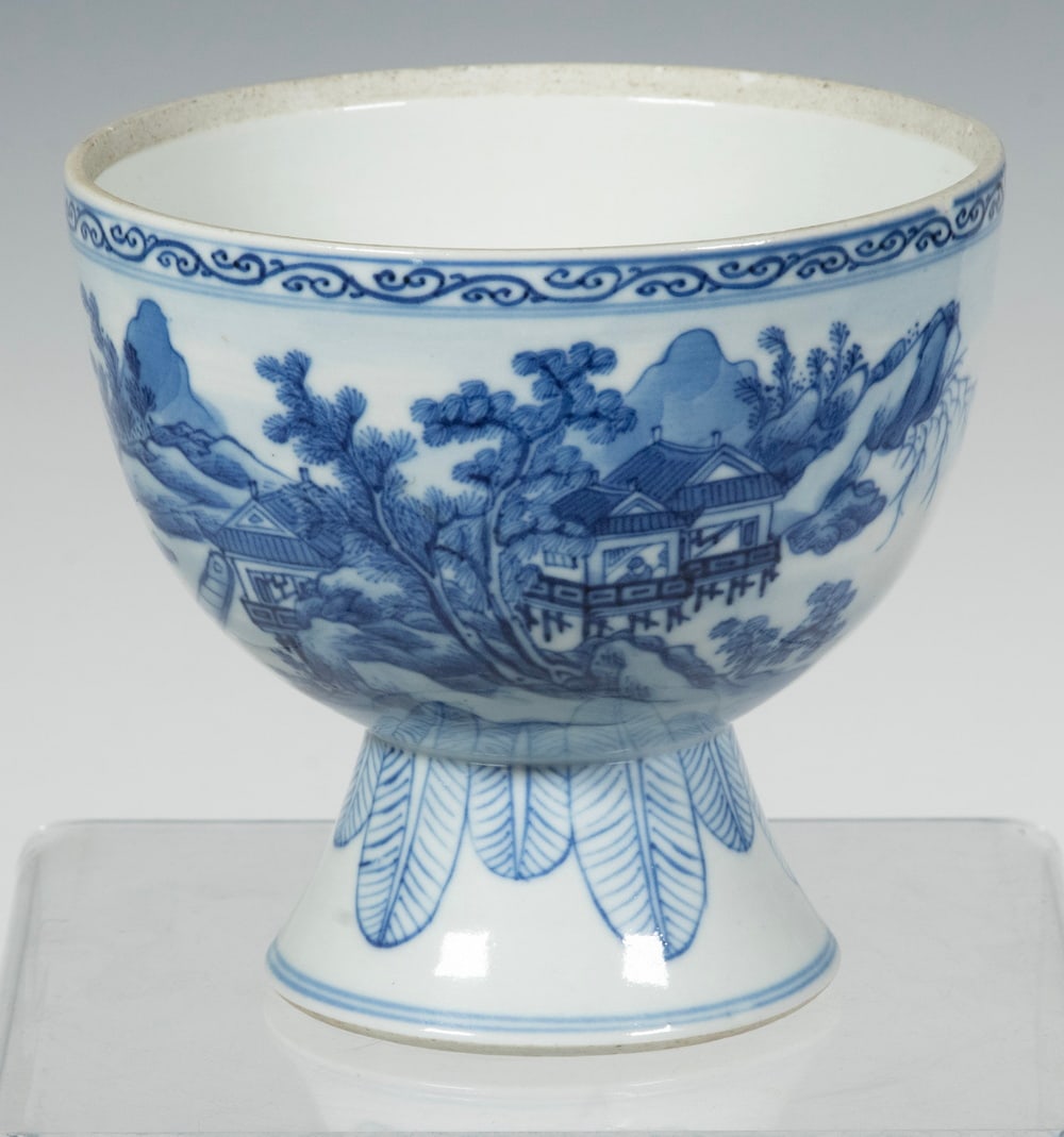 CHINESE BLUE AND WHITE PORCELAIN STEM BOWL, REPUBLIC PERIOD: Of traditional stem bowl form, the exterior is finely decorated in underglaze blue with a continuous mountainous landscape scene of pavilions and pine trees, interspersed with poetic inscriptions. The