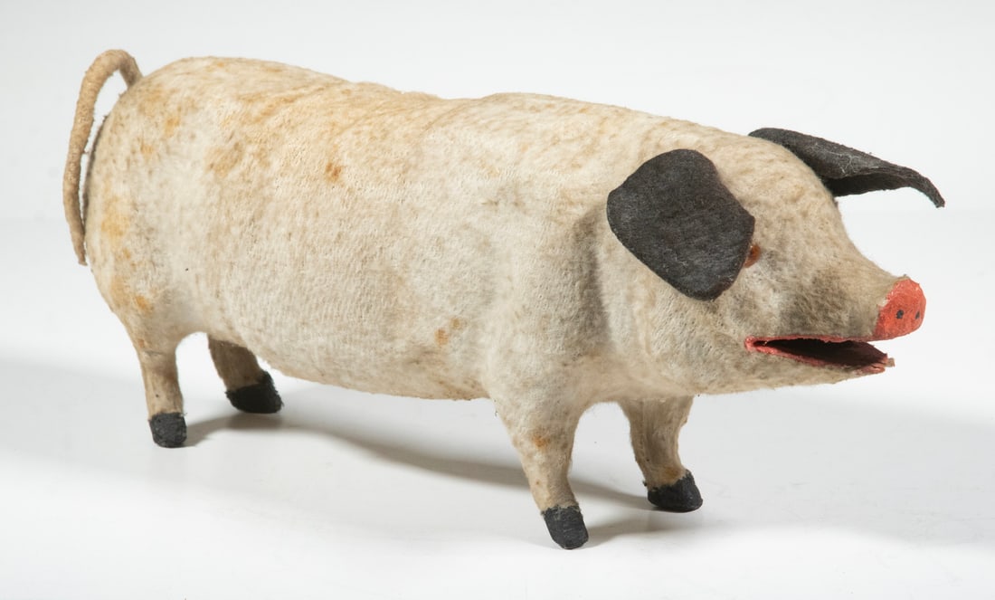 CIRCA 1900 HOME-MADE CLOTH PIG TOY: White Pig in flannel covered papier mache head and hindquarters with soft midsection, possibly a converted candy box, having brown felt ears, glass eyes, painted snout, mouth and feet. Worn from play.