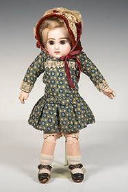 JUMEAU DOLL W/ BONNET: Blonde, with bisque head, brown glass eyes, blue and white cotton chintz, Height: 12 in. (30.5 cm.)