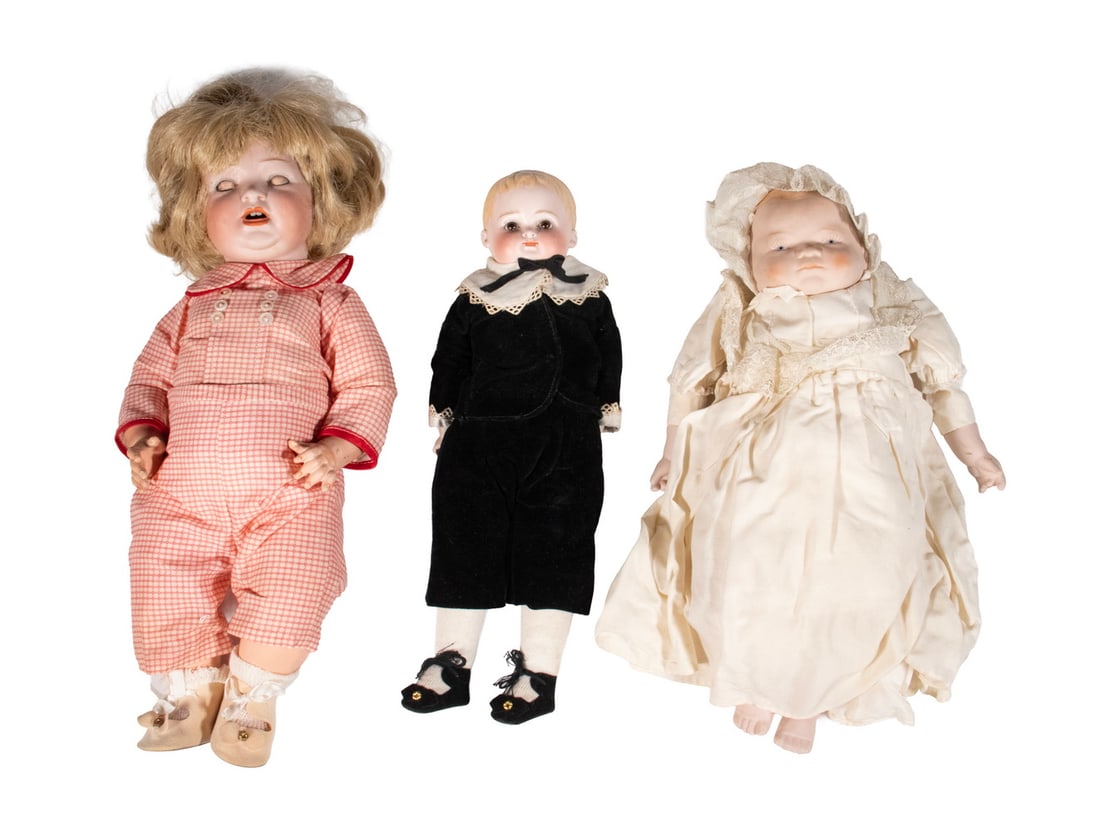 (3) VINTAGE BISQUE HEAD DOLLS: All probably German, including: Character doll, with blue sleep eyes, blonde wig, open mouth, painted features, composition body, original outfit, unmarked, 14 1/2" long, finger tip chips; Boy school