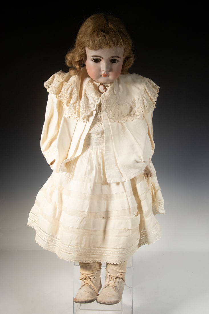 LARGE GERMAN SLEEP EYE BISQUE HEAD DOLL IN WHITE: Girl in White Summer Day Dress, with blonde pate hair, brown glass sleep eyes, white kid boots. Height: 24 in. (61 cm.)