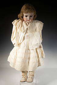 LARGE GERMAN SLEEP EYE BISQUE HEAD DOLL IN WHITE: Girl in White Summer Day Dress, with blonde pate hair, brown glass sleep eyes, white kid boots. Height: 24 in. (61 cm.)