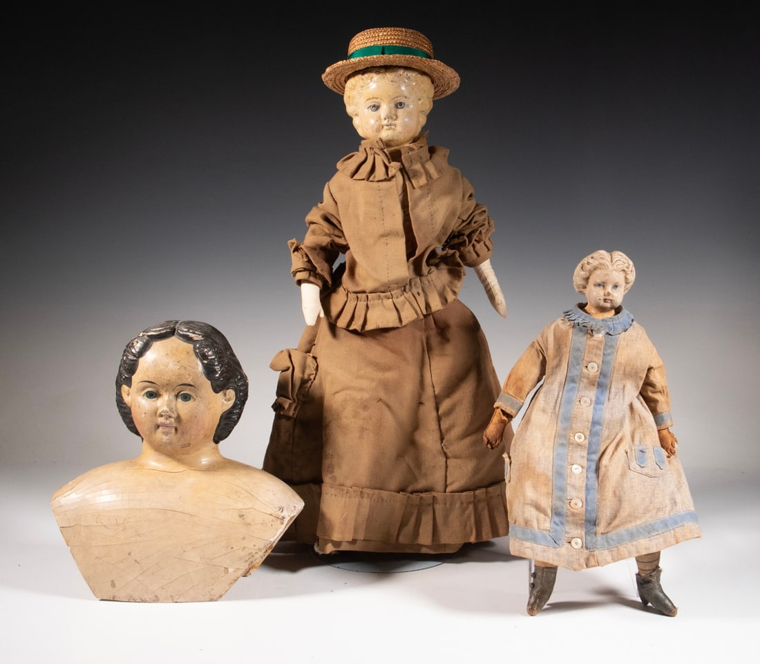 (2) COMPOSITION HEAD DOLLS & (1) LG COMPO HEAD, CA 1880: Including: 19" blonde in tan suit with straw hat, kid leather body; PLUS 14" blonde in blue and white dress, cloth body; PLUS 10" Jenny Lind head with old Greiner's label. Lgst: 20 x 6 x 3 in. (50.8 x