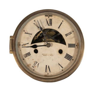 ENGLISH SHIP'S CLOCK BY HENRY BROWNE & SON: Early 20th century brass cased ship's clock, with key, and white dial with Roman numerals marked "Henry Browne & Son Ltd., Barking & London" recto and "Made in England" both recto and verso. Case: