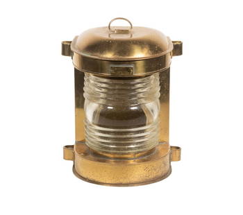 20TH C. PERKO ELECTRIC SHIP MASTHEAD LAMP: Solid Brass with clear fresnel lens, mounting lugs on sides, locking baseplate held socket, now missing. Manufactured by Perkins Marine Lamp and Hardware Co. of Miami, Florida. 12 x 10 x 7 in.