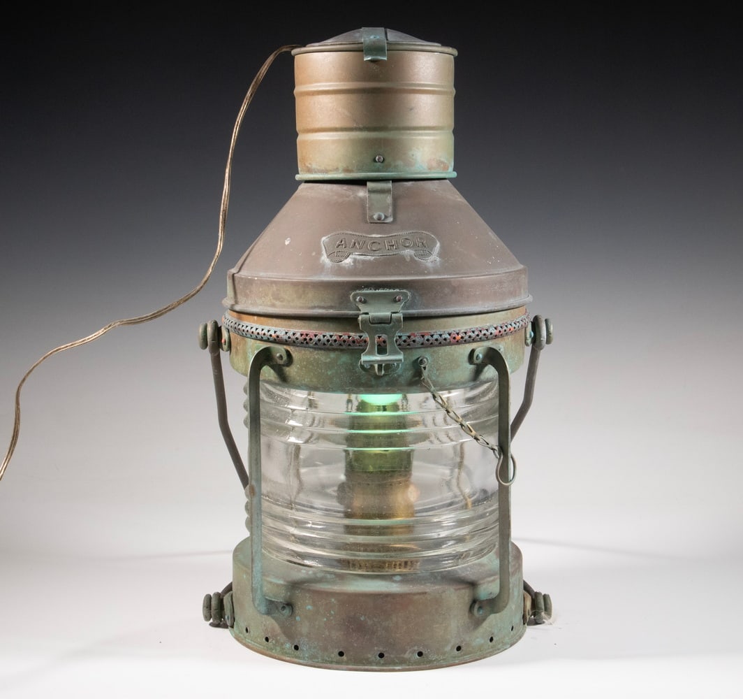 COPPER SHIP'S LANTERN HANGING LIGHT FIXTURE: Vintage Marine Anchor Lantern, electrified and repurposed as a hanging fixture, with a copper frame and a clear Fresnel lens, swing handle; the interior retains the original kerosene burner but is als