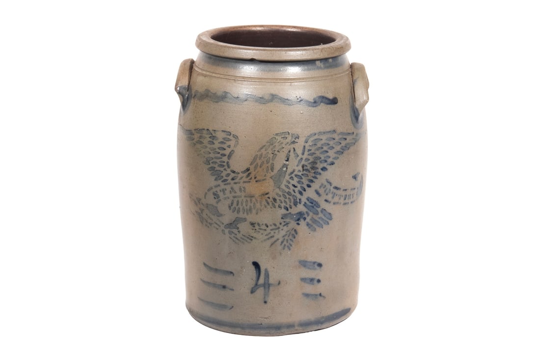 STAR POTTERY, GREENSBORO, PA EAGLE CROCK: Circa 1875 4-Gallon Pennsylvania Stoneware Jar, by Star Pottery (Hamilton & Jones, Greensboro) having stenciled decoration of a spread wing eagle and riband with "Star Pottery", plus freehand painted