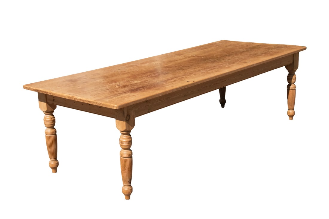 19TH C. IRISH PINE FARM TABLE: Kitchen Table for a Large Farm, bleached pine with thick overhanging plank top, (removeable, held on by wood turn blocks), having a deep skirt and four heavy duty turned legs. Size: 30 x 107 x 41 1/2