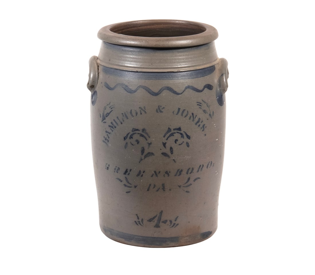 HAMILTON & JONES, GREENSBORO, PA STONEWARE CROCK: Circa 1875 4-Gallon Salt Glazed Cylindrical Jar, the front stenciled "Hamilton & Jones, Greensboro, PA" and with floral and freehand painted decoration, having a tooled shoulder and applied lug side h