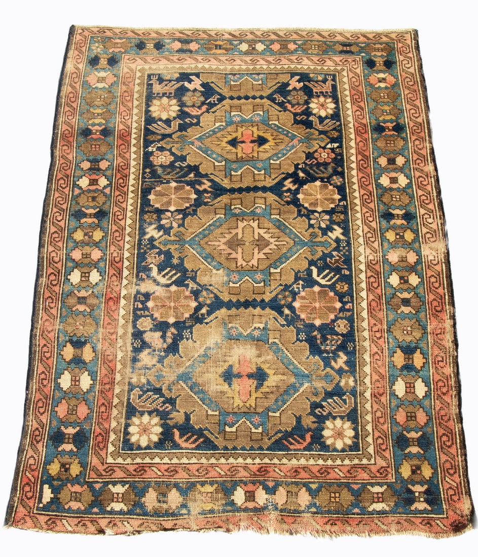 KUBA RUG (3'5" x 4'9"): Northeast Caucasus rug, features three sky blue hexagonal medallions inset on terra cotta medallions on the densely decorated midnight blue field with a sky blue rosette border. Salvage repaired, seve