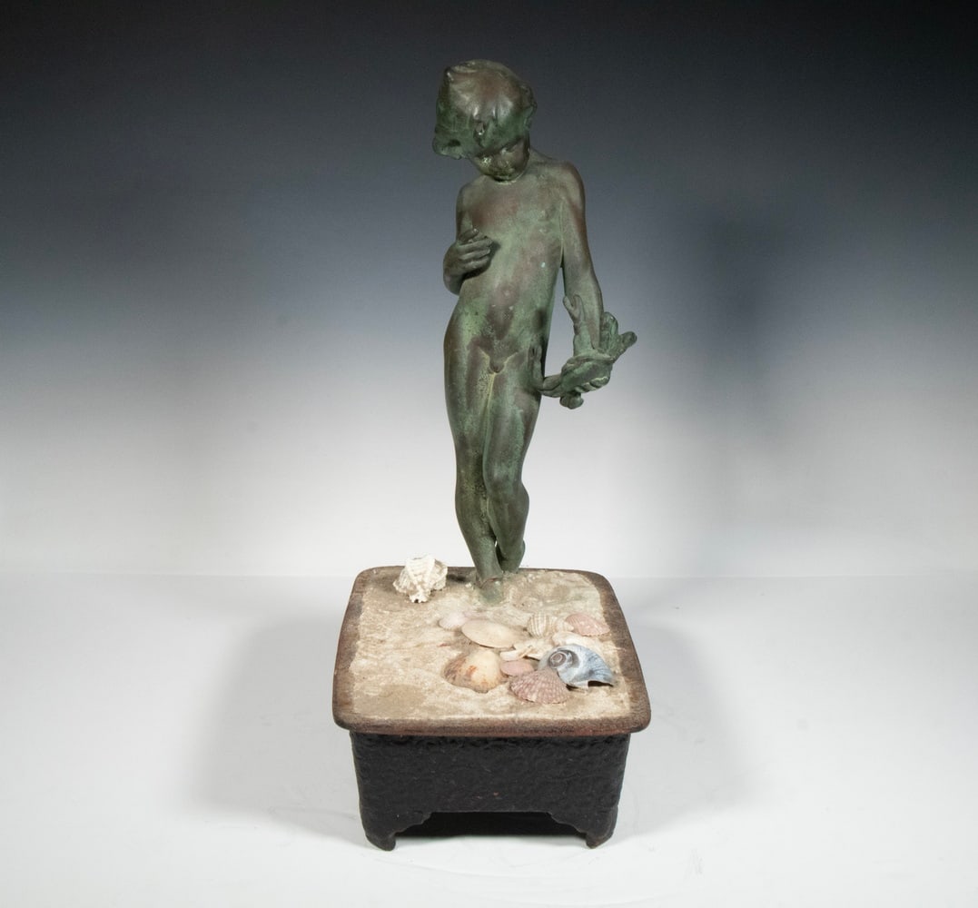 GIUSEPPE BENEDUCE (ITALY, 1890 - ?): Bronze Clad Standing Figure of Naked Boy on Beach, holding a crab, circa 1930, set into iron Suiban iron Bonsai tray with cement, some sea shells applied. Size: 18 x 12 x 7 1/2 in. (45.7 x 30.5 x 19.1