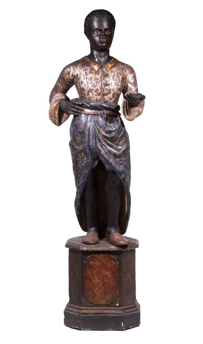 PERIOD VENETIAN BLACKAMOOR FIGURE: 18th c. Carved and Painted Wood Standing Blackamoor Figure on Integral plinth, with gold and silver scraffito highlights, the young negro boy with a saucy smile on his puckish features is holding out 
