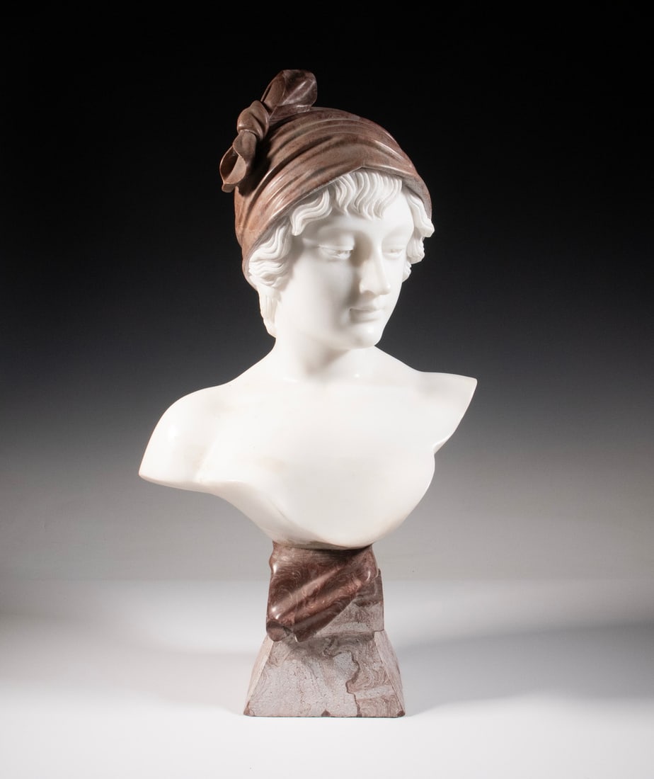 ITALIAN BUST OF WOMAN IN ALABASTER & BLOOD MARBLE: Baigneuse, Woman with Bathing Scarf tied over short hair, unsigned, circa 1900, on integral unpolished blood marble plinth. OS: 25 x 14 x 10 in. (63.5 x 35.6 x 25.4 cm.)