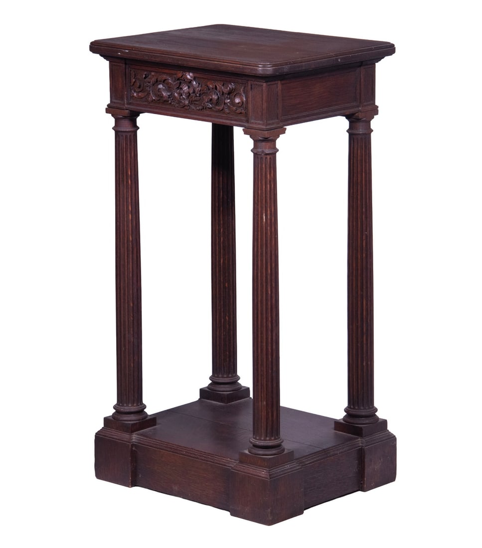 OAK SIDE TABLE: Vintage Stand with molded edge top, single drawer with floral carved front, set on four column form reeded cylindrical legs, open lower shelf at base. 36 1/2 x 19 1/2 x 16 in. (92.7 x 49.5 x 40.6 cm.)
