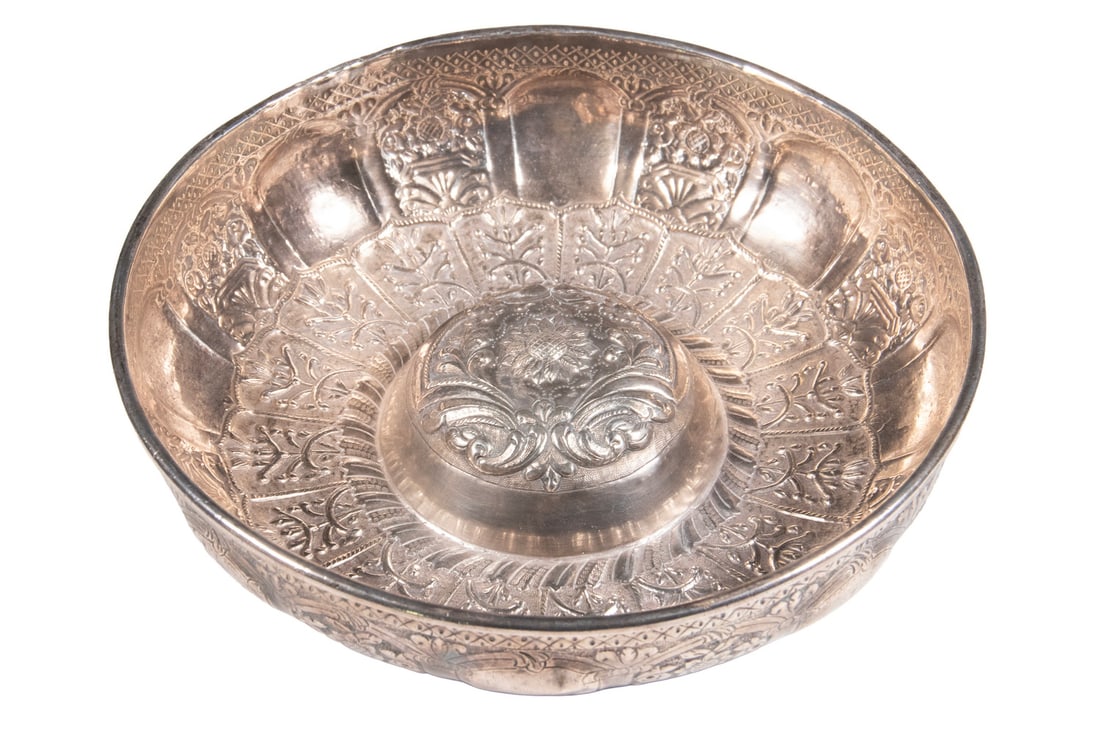 TURKISH REPOUSSE BOWL, LATE 19TH CENTURY: A finely crafted deep silver bowl, the exterior and interior richly decorated with chased and repoussé floral panels encircling the surface, centering a rosette medallion. Tests as silver. Ottoman Em
