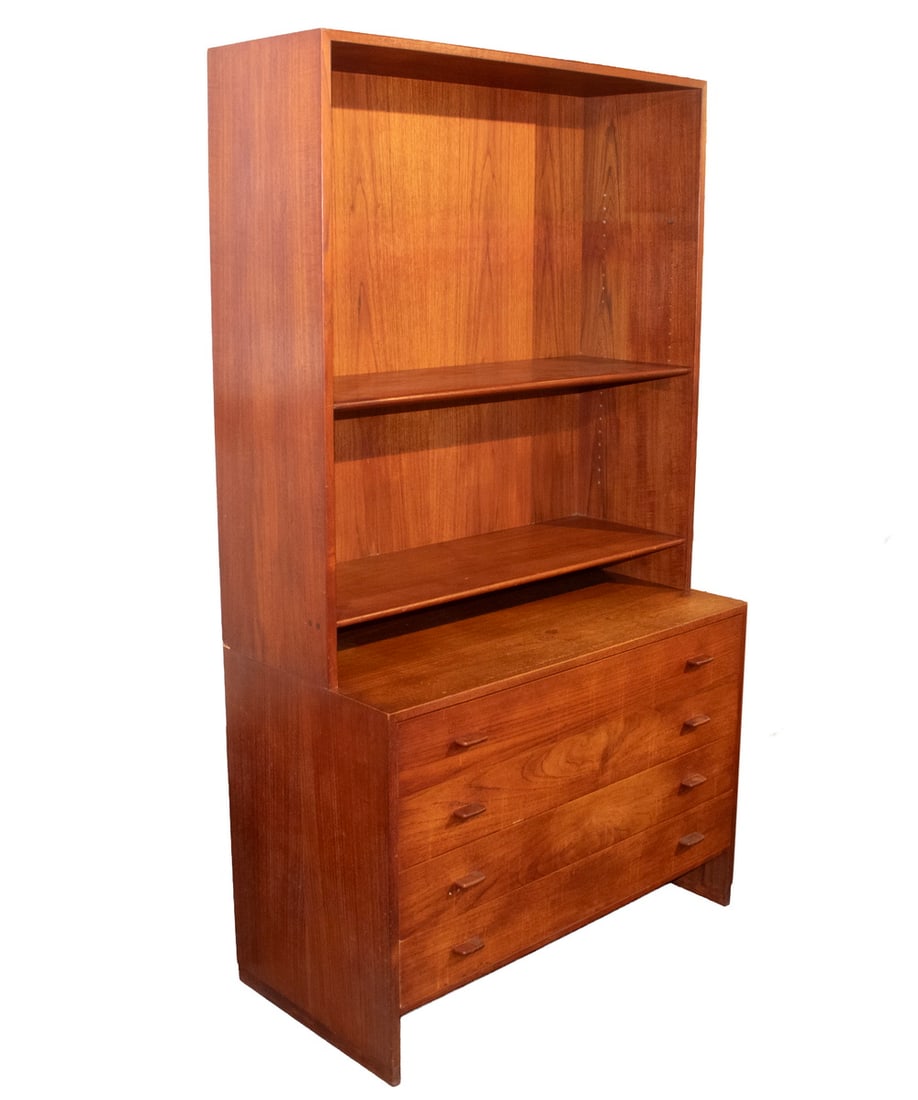 (2 PART) DANISH MODERN TEAK CHEST WITH BOOKCASE: Four Drawer Chest with contrasting dark wood tongue pulls, having an upper bookcase joined by metal tabs, 28" to working surface, unmarked. OS: 71 x 42 x 19 in. (180.3 x 106.7 x 48.3 cm.)