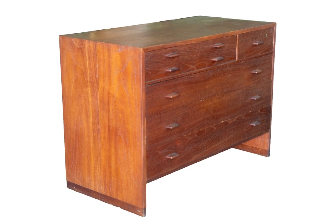 FOUR DRAWER MODERNIST TEAK CABINET: Dresser with top two shallow drawers lined with green felt, with contrasting wood tongue pulls. OS: 28 x 39 1/2 x 13 in. (71.1 x 100.3 x 33 cm.)