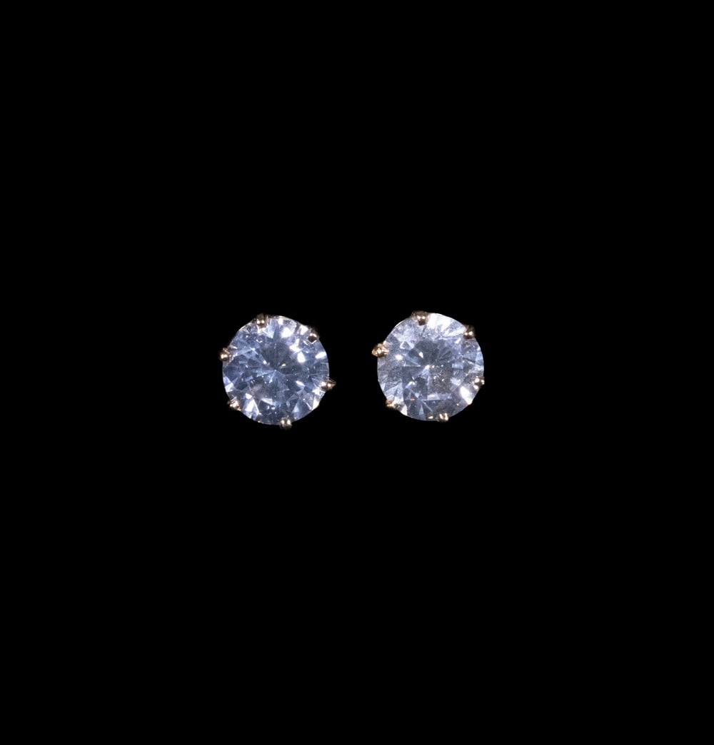 PR 14K GOLD AND CUBIC ZIRCONIA STUD EARRINGS: A pair of 14K yellow gold stud earrings, each set with a round brilliant-cut 2.0 ct. cubic zirconia in a six-prong mounting. Posts and backs stamped “14K.” 2.3 dwt. total weight. Overall g