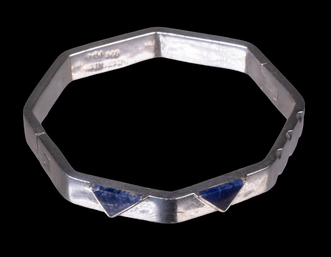 MEXICAN TAXCO STERLING SILVER BRACELET: An octagonal sterling silver bracelet with geometric lapis lazuli inlay panels, marked “Mexico 925 TR-8.” 1.58 ozt. total weight. Overall in good condition with minor wear consistent with