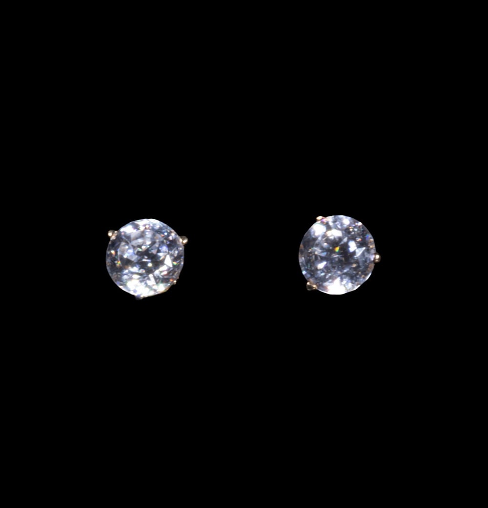 PR 14K GOLD AND CUBIC ZIRCONIA STUD EARRINGS: A pair of 14K yellow gold stud earrings, each set with a round-cut cubic zirconia in three-prong mountings, totaling approximately 3.00 carats. 1.9 dwt. total weight. Overall good condition.