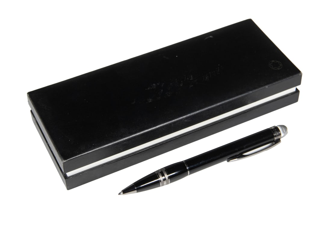 MONTBLANC STARWALKER MIDNIGHT BLACK RESIN BALLPOINT PEN: A Montblanc StarWalker ballpoint pen in midnight black resin with polished metal trim and twist-action mechanism. The pen features the signature floating white star emblem under a transparent dome on