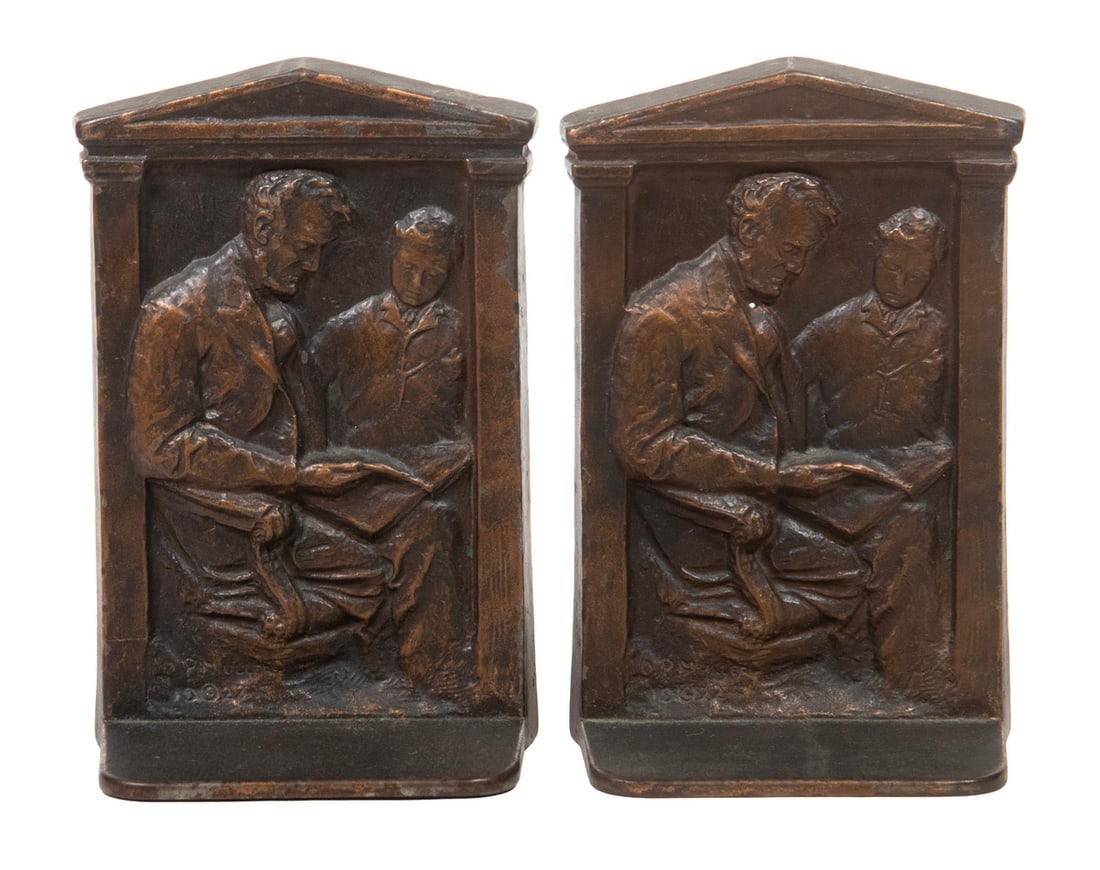 PR CAST BRONZE BOOKENDS “LINCOLN WITH SON,” SIGNED O.P. MULLER, 1922: A finely cast bronze bookend set depicting Abraham Lincoln reading with his son, designed by sculptor O.P. Müller. The lower left corner signed “O.P. MULLER,” 1922 and reverse
