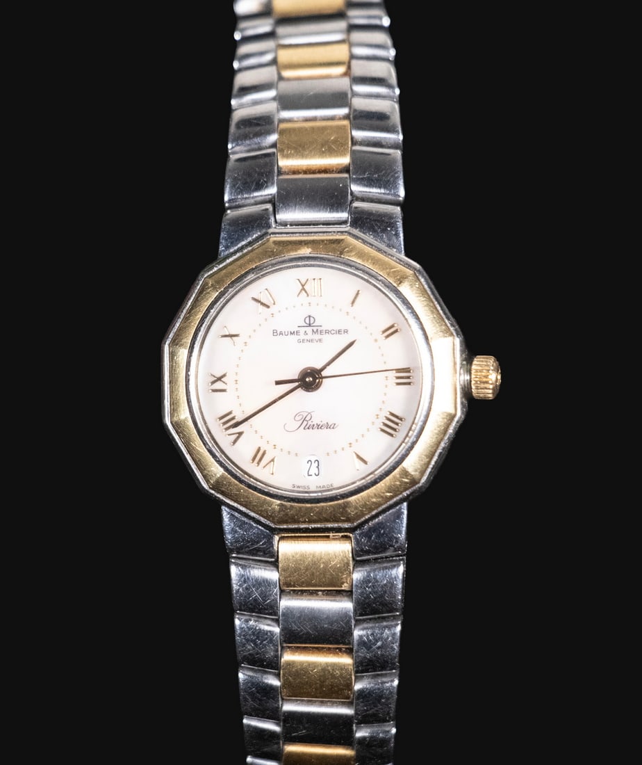 BAUME & MERCIER GOLD-PLATED STAINLESS STEEL QUARTZ WATCH: A Baume & Mercier Riviera ladies’ quartz wristwatch, featuring an octagonal bezel with gold-plated accents, white mother-of-pearl dial with Roman numeral markers, date aperture at 6